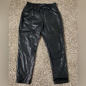 Black faux leather joggers. Stretch band with tie.